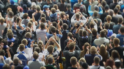 Sports fans clapping hands at stadium, supporting their team, excited crowd. Fans watching game, 4K