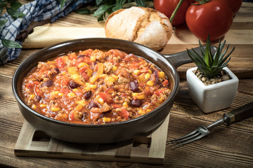 Chili con carne in a clay pan.