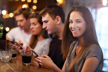 Group Of Friends Enjoying Meal In Restaurant