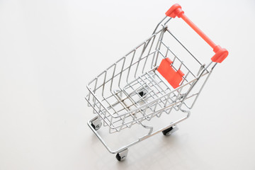 Shopping cart on white background with copy space