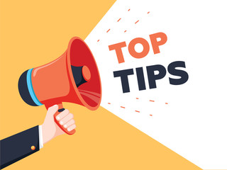 Male hand holding megaphone with Top Tips speech bubble. Loudspeaker. Banner for business, marketing and advertising.