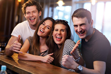 Group Of Friends Enjoying Meal In Restaurant