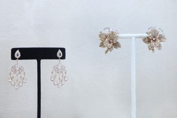 Different two pairs of earrings studded with diamonds