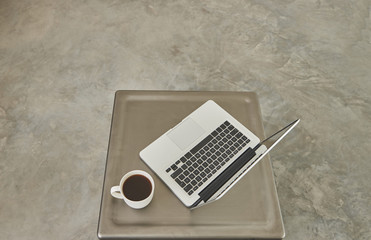 technological tools laptop coffee and table.