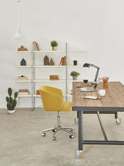 white wall new style office and workplace vertical decoration table chair devices and bookshelf style.