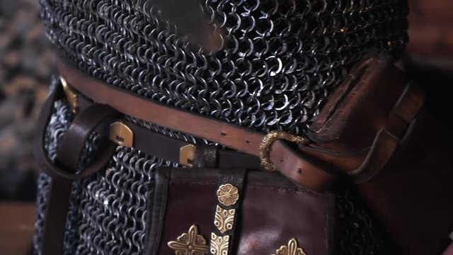 Close-up of the hands of a viking sheathed sword.