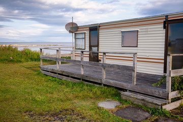 Cabin on ocean shore at Scottish Highlands