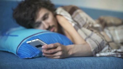 After triggering the alarm on the phone wakes up the sleeping man