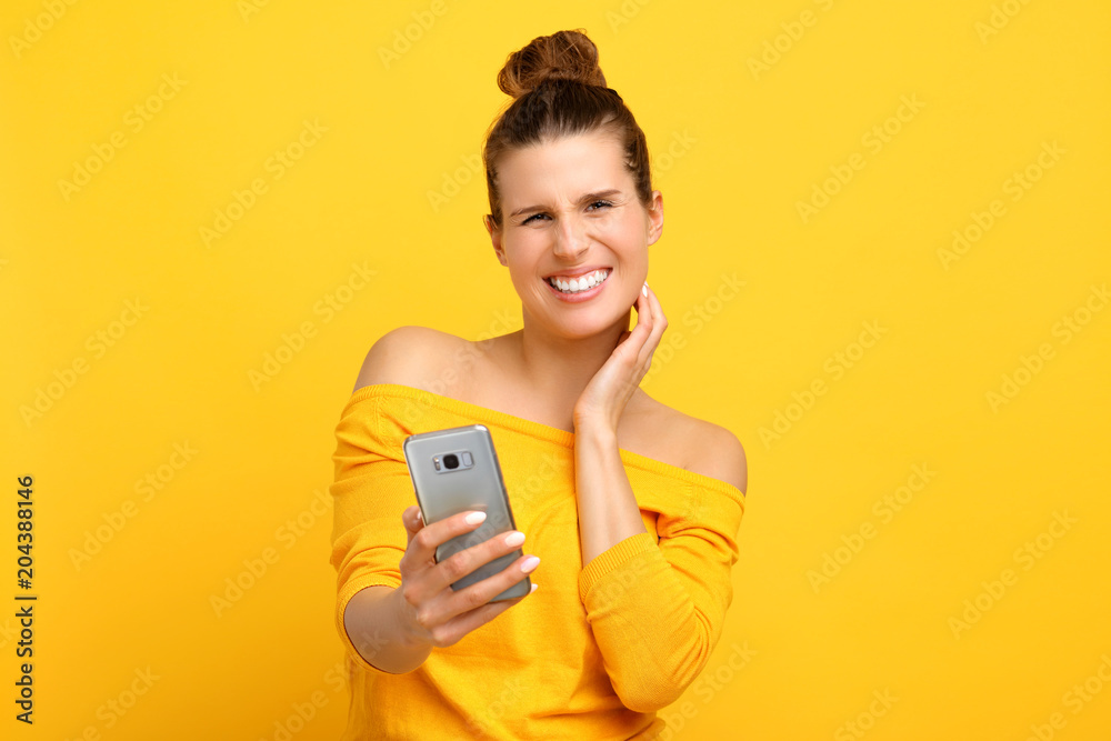 Poster Woman against yellow wall background