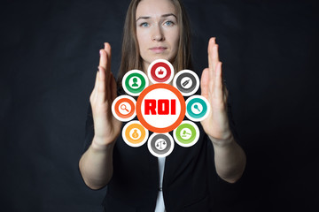 A businessman shows an inscription:ROI