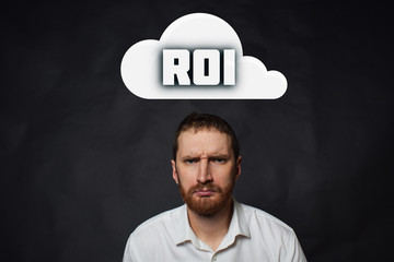 Above the businessman hangs a cloud with the inscription:ROI