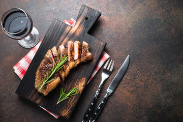 Grilled beef striploin steak top view.