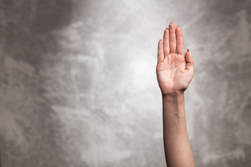 Female hand on dark background