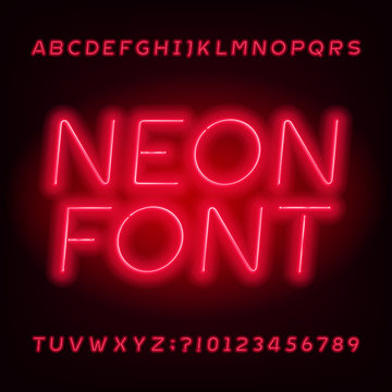 Red neon tube alphabet font. Neon color oblique letters and numbers. Stock vector typeface for your design.