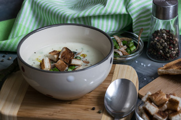 Delicious asparagus soup with bacon, fried asparagus and homemade pastries