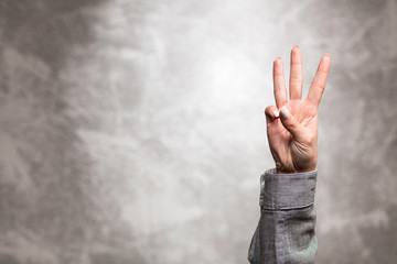 Female hand on dark background