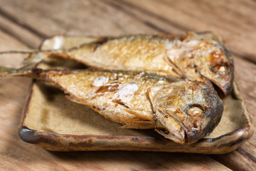 Fried Mackerel on Wooden Table.