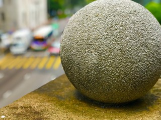 Stone statue along side the road to the central business district in Hong Kong. Mainly rounded stones but some layers were already shed off. Closeup on the stones gives you the feeling of loneliness.
