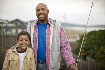 Father and son prepare to go fishing.