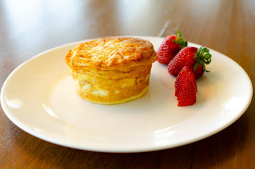 Plated breakfast quiche with strawberries