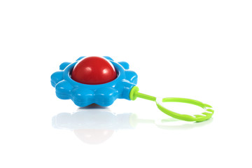 Naklejka premium Baby rattle in the shape of a flower on a white background