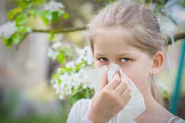 Pollen allergy, blowing nose due to an allergic reaction  - obrazy, fototapety, plakaty