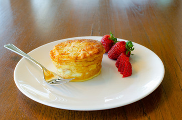 Plated breakfast quiche with strawberries