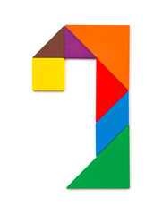 wooden tangram shaped like a number 7 on white