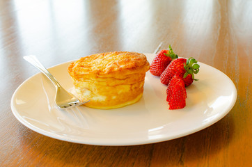 Plated breakfast quiche with strawberries