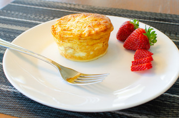 Plated breakfast quiche with strawberries
