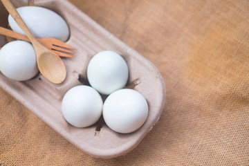 White eggs in carton container