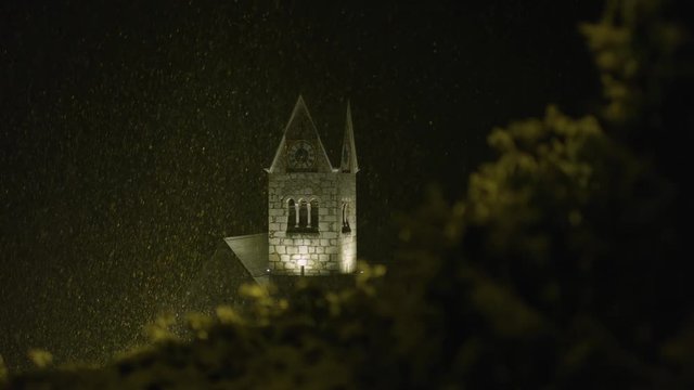 Clock tower on a snowy night