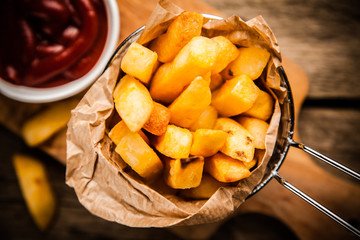 French fries on wooden table