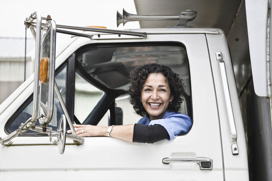 Female Truck Driver With Her Delivery Truck