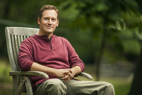 Man sitting in lawn chair.