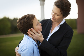 Portrait of mother and son in their backyard.