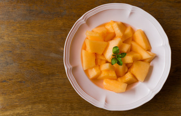 fresh melon slices on dish