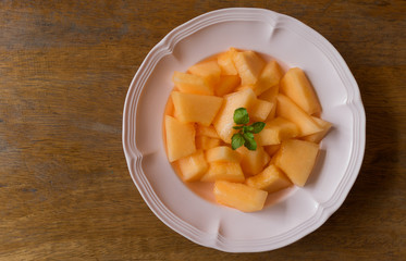 fresh melon slices on dish