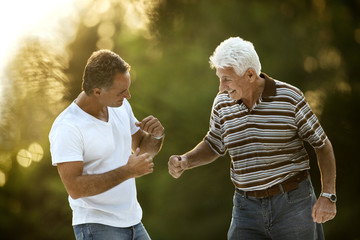 Portrait of senior man with his adult son.
