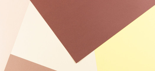 Colorful soft brown, beige and yellow paper background.