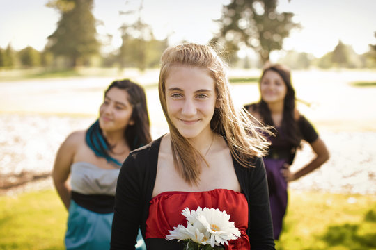 Three teenage girls in the park.