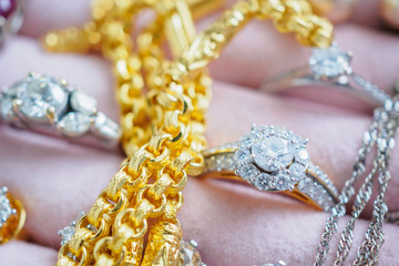 Gold and silver diamond gemstone ring necklaces and earrings in luxury jewelry box