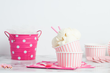 vanillia ice cream in a pink styled setting