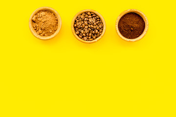 Ground seasoning for cooking desserts. Cinnamon, cocoa, coffee powder on yellow background top view copy space