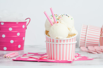 vanillia ice cream in a pink styled setting