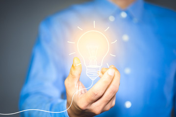 Light bulb drawn in the hands of businessman. new ideas, Innovative idea concept.