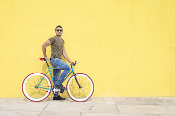 Man posing with his fixed gear bicycle