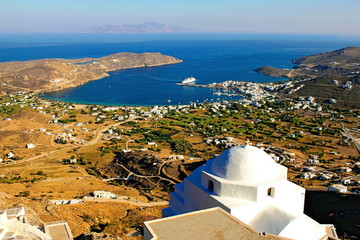 View of Christian orthodox church with Livadi, the port of Serifos island in the background....