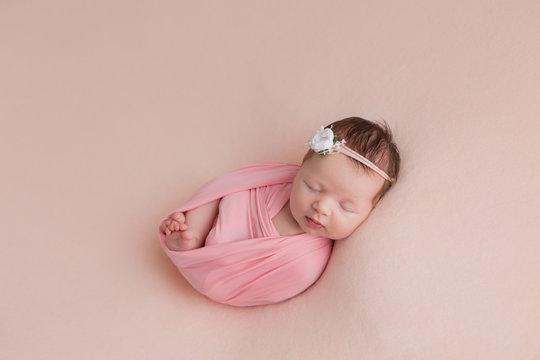 newborn girl. newborn photo shoot. newborn baby in pink on pink background
