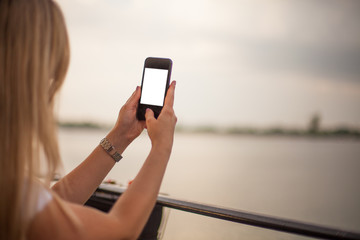 Woman taking photo with smartphone camera